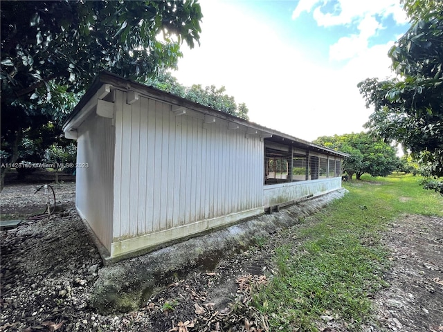 view of property exterior featuring a lawn