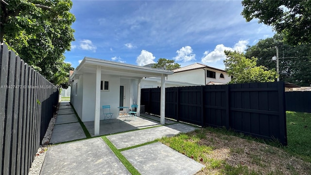 rear view of house featuring a patio