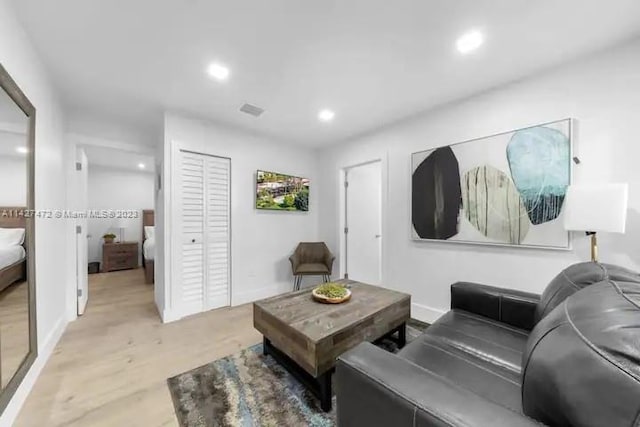 living room with light hardwood / wood-style floors