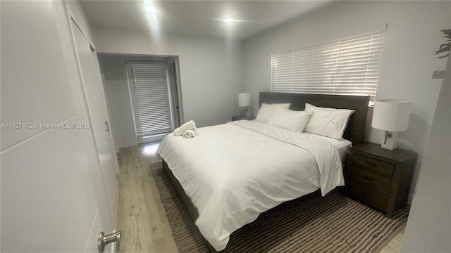 bedroom with dark wood-type flooring