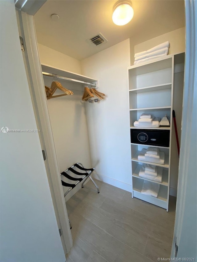 spacious closet featuring hardwood / wood-style floors