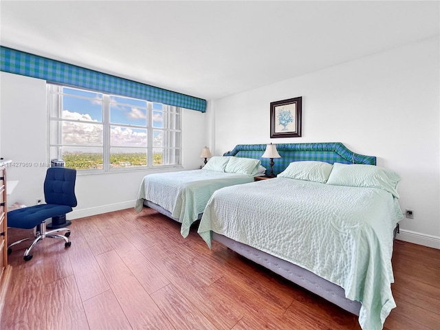 bedroom with wood-type flooring