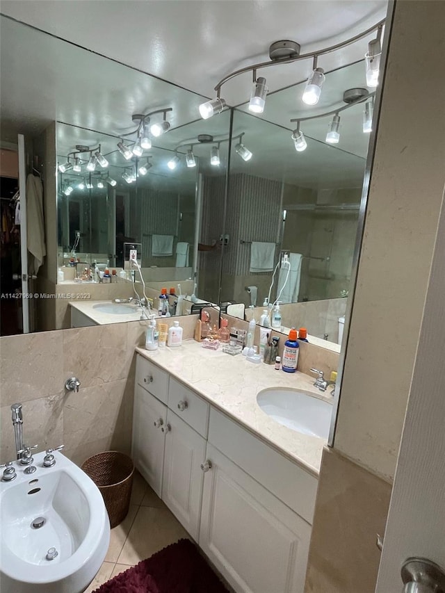 bathroom with vanity, tile floors, and tile walls