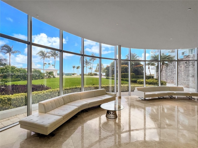 unfurnished living room featuring floor to ceiling windows