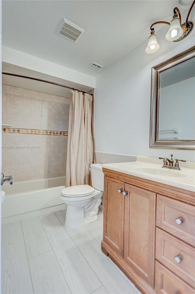 full bathroom featuring shower / bathtub combination with curtain, tile flooring, vanity, and toilet