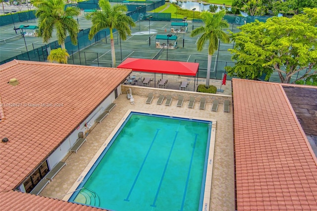 view of swimming pool with central AC unit