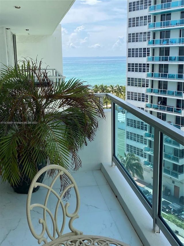 balcony featuring a water view