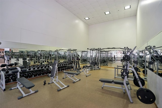 workout area with a paneled ceiling