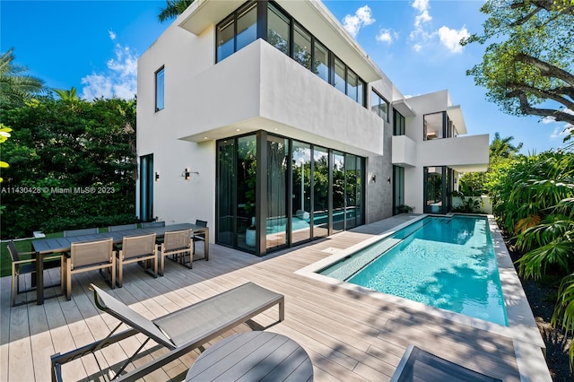 view of pool with a wooden deck