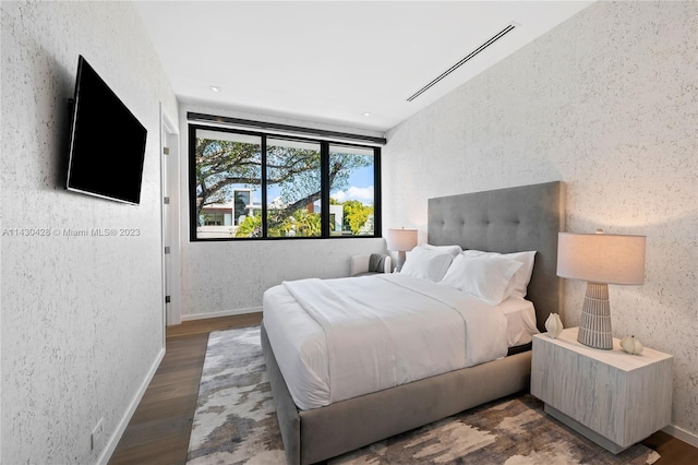 bedroom featuring dark wood-type flooring