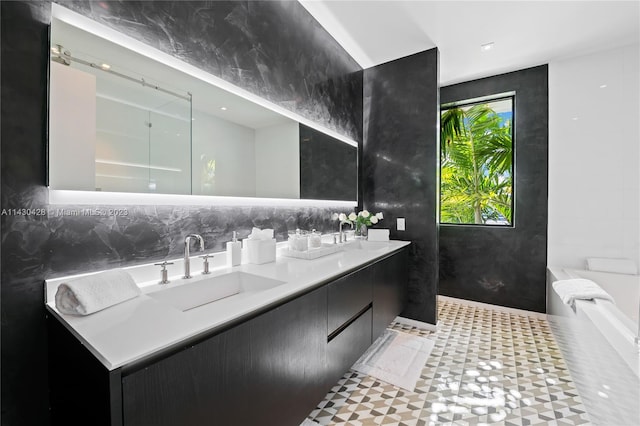 bathroom featuring a shower and vanity