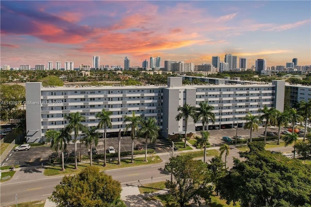 property at dusk with a view of city