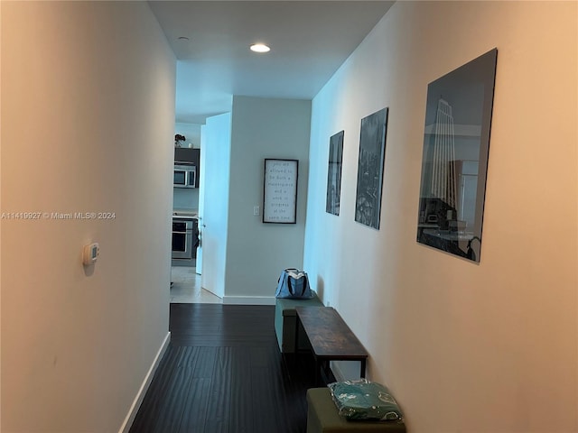 corridor featuring dark hardwood / wood-style floors