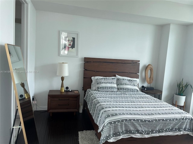 bedroom featuring dark hardwood / wood-style floors