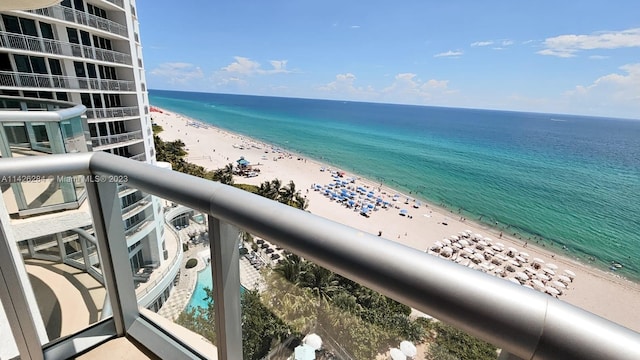 exterior space featuring a water view and a beach view