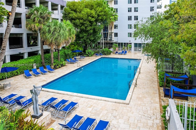 view of swimming pool with a patio area