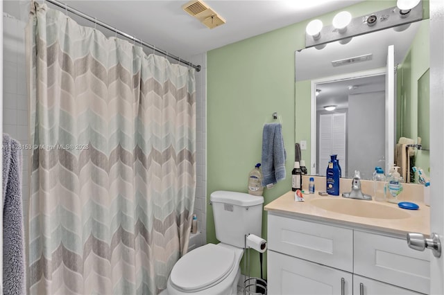 full bathroom featuring toilet, shower / bath combo, and vanity