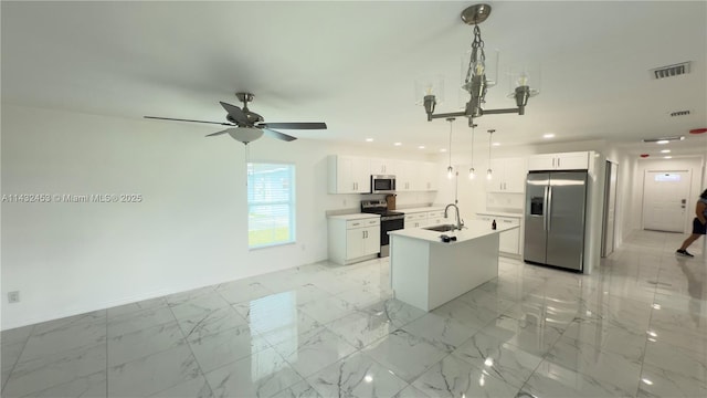 kitchen with visible vents, an island with sink, stainless steel appliances, marble finish floor, and white cabinetry