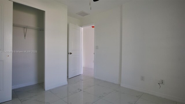 3433 Jeffcott St, Fort Myers, FL 33916 - unfurnished bedroom featuring marble finish floor, a closet, baseboards, and visible vents