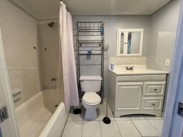 full bathroom with toilet, tile flooring, vanity, and shower / bath combo with shower curtain