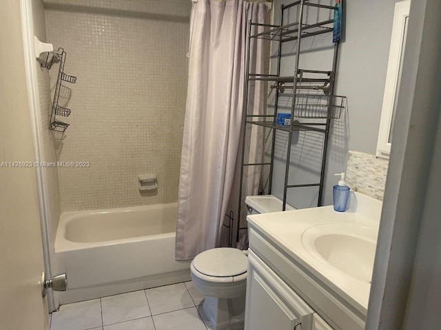 full bathroom with toilet, shower / bath combo, vanity, and tile flooring