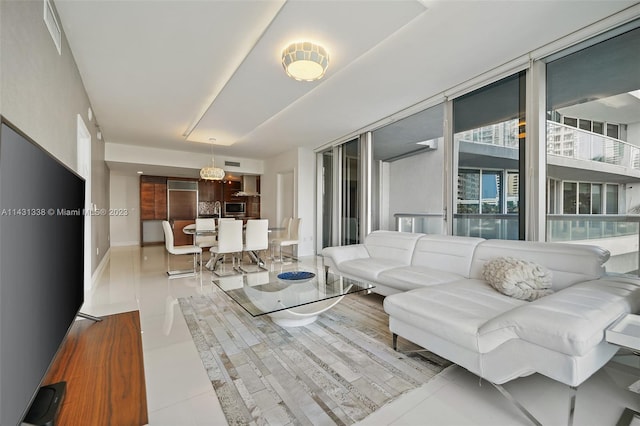 interior space with expansive windows and light tile floors