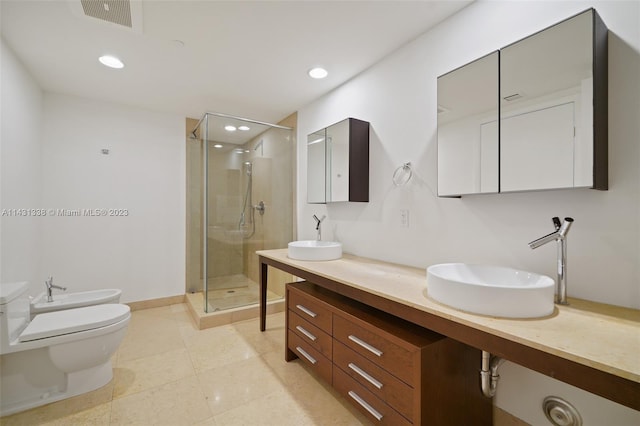 bathroom featuring tile flooring, toilet, double vanity, a shower with shower door, and a bidet