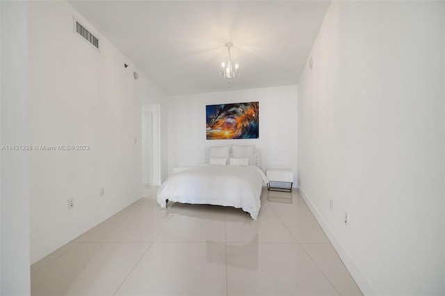 bedroom featuring a chandelier and light tile flooring