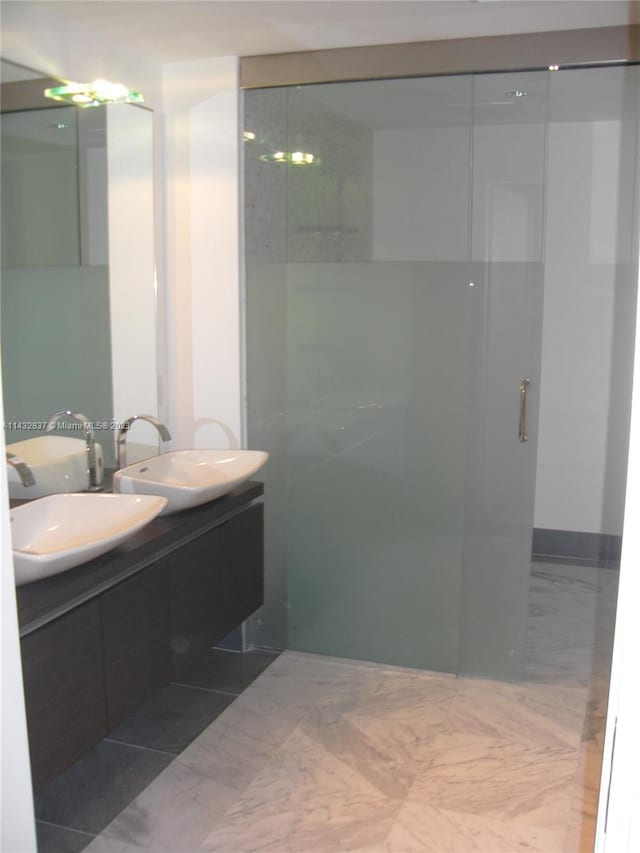 bathroom with tile flooring and vanity with extensive cabinet space