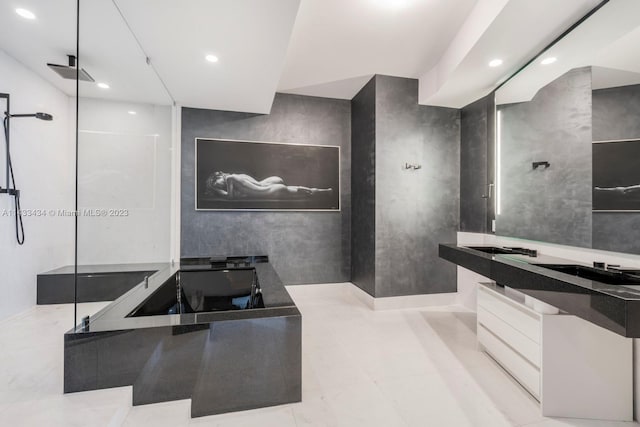 bathroom featuring plus walk in shower, tile floors, and oversized vanity