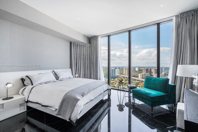 tiled bedroom featuring expansive windows and multiple windows