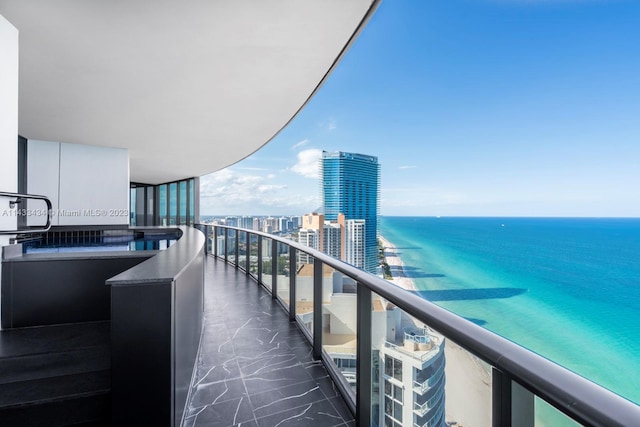 balcony featuring a water view