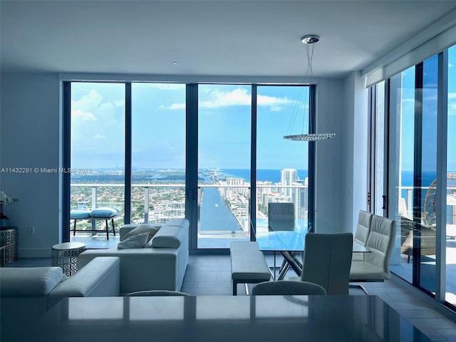 living room featuring expansive windows and a water view