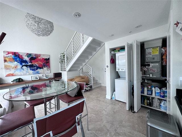 dining area with stacked washing maching and dryer