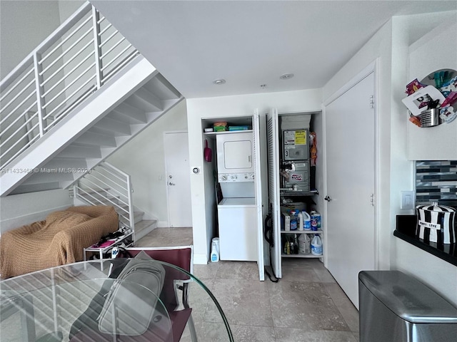 interior space featuring stacked washer / dryer