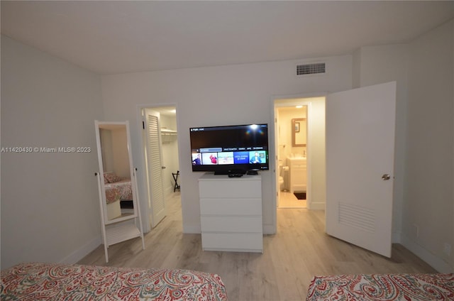 bedroom with light hardwood / wood-style floors