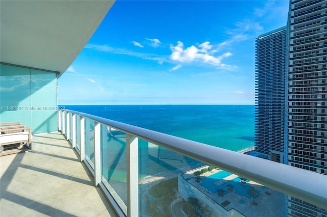 balcony featuring a water view