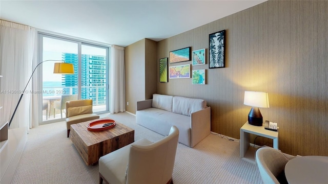 living room with light carpet and floor to ceiling windows