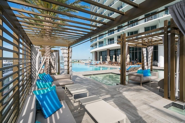 view of pool featuring a patio area and a pergola