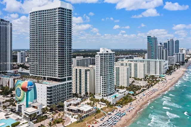 property's view of city featuring a beach view and a water view