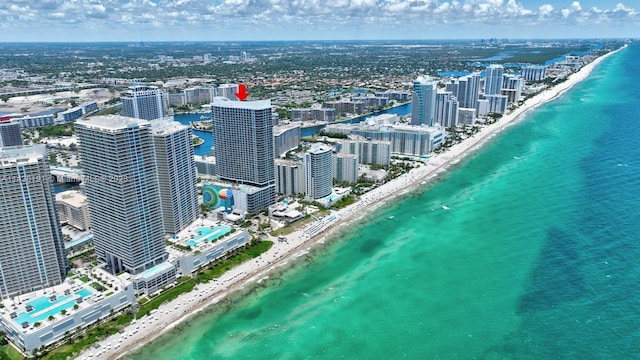 bird's eye view featuring a beach view and a water view