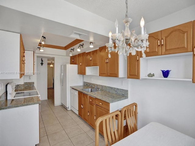 kitchen featuring a notable chandelier, dishwasher, light tile flooring, range, and sink