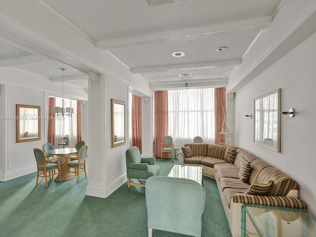 living room featuring carpet flooring, a notable chandelier, beamed ceiling, and a textured ceiling