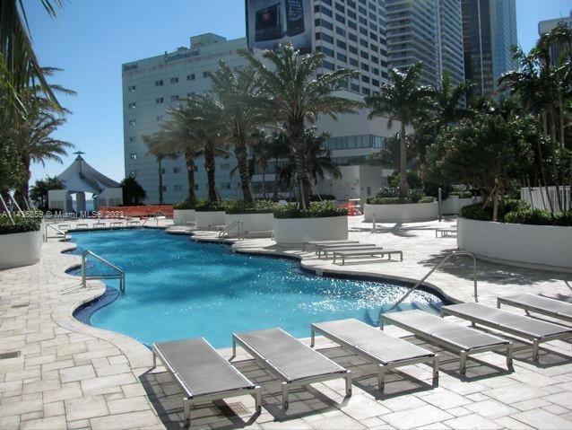 view of swimming pool with a patio area