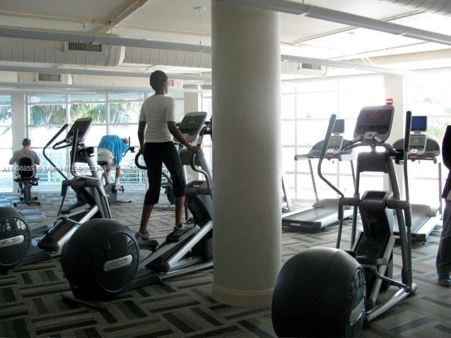 gym with dark colored carpet