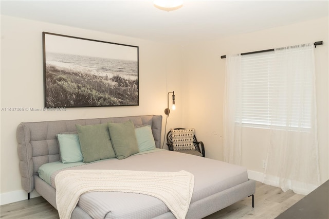 bedroom with light hardwood / wood-style floors