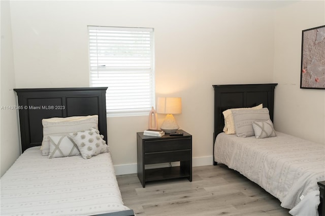 bedroom with light hardwood / wood-style floors