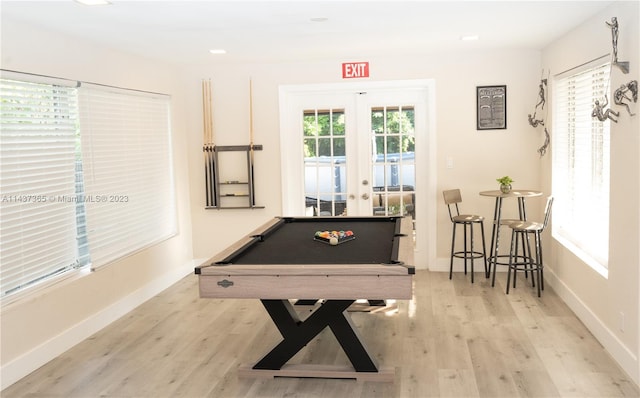 playroom featuring a wealth of natural light, french doors, pool table, and light wood-type flooring