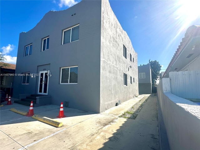 view of side of home featuring a patio area