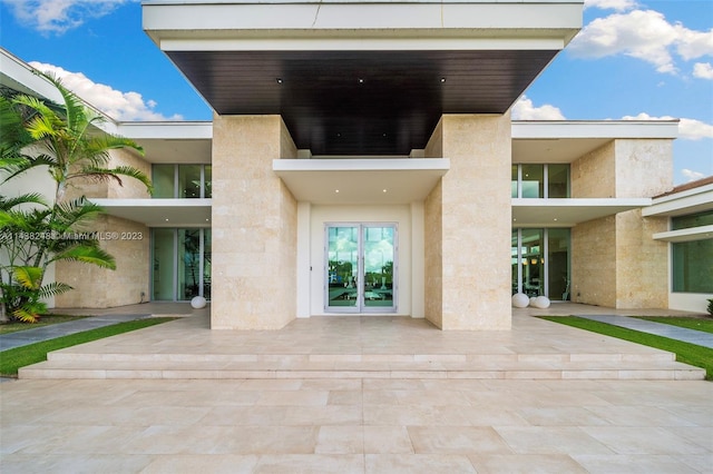 doorway to property featuring a patio area